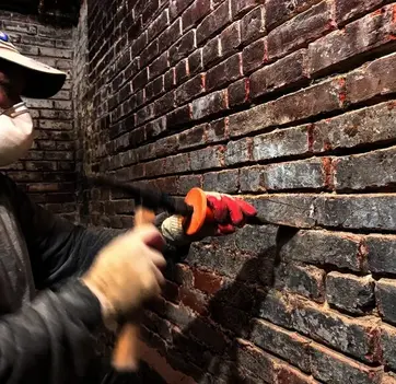 Man working on brick