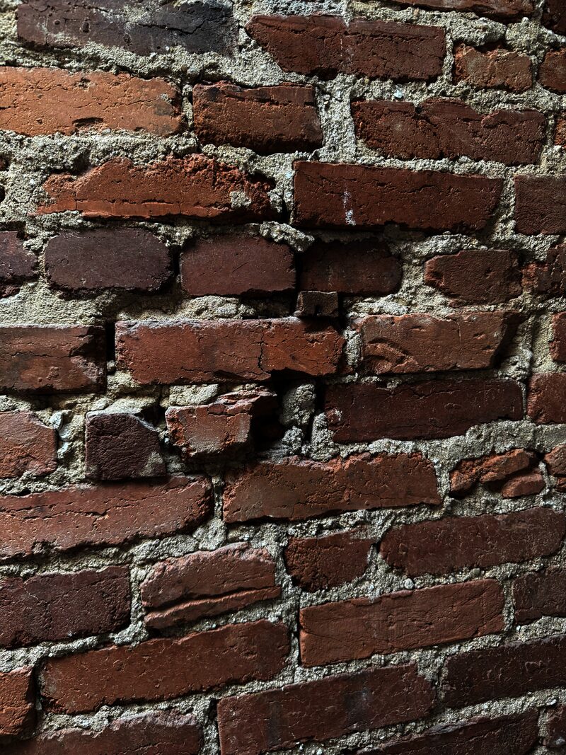 Damaged brick wall showing deterioration