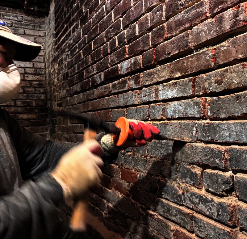 Man working on brick